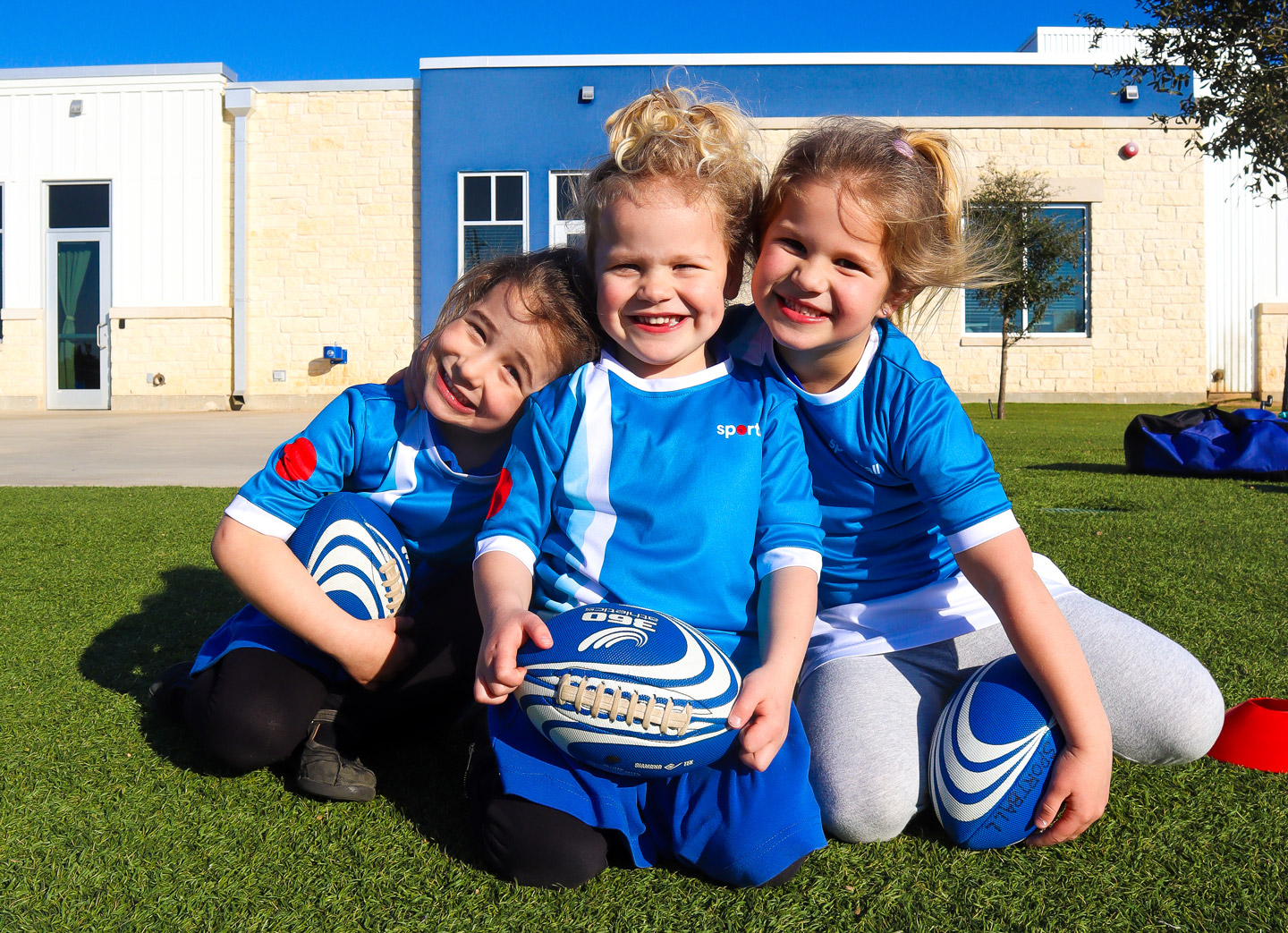 Three smiling girls Sportball